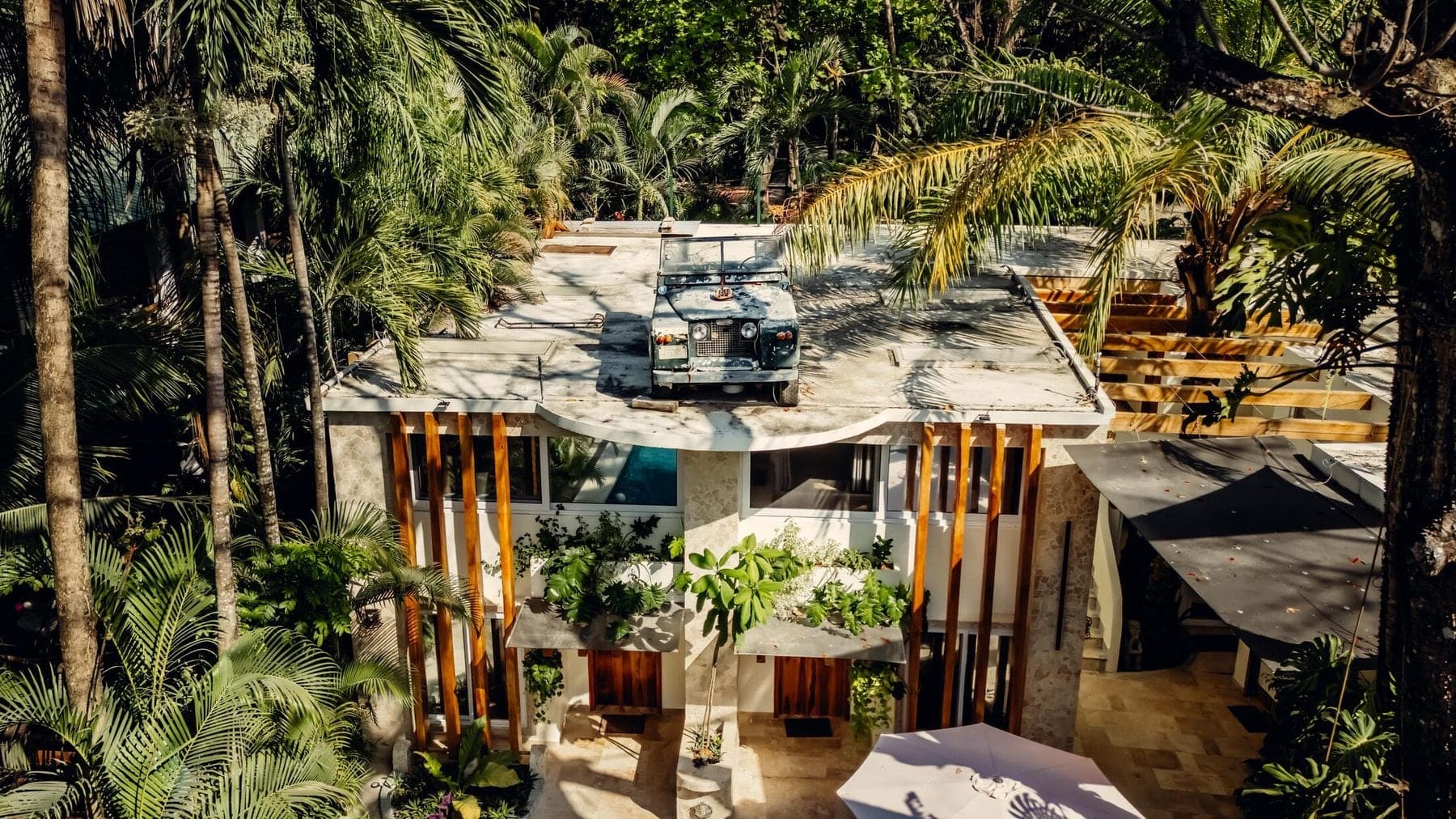 The hotel wrapped in tropical green
