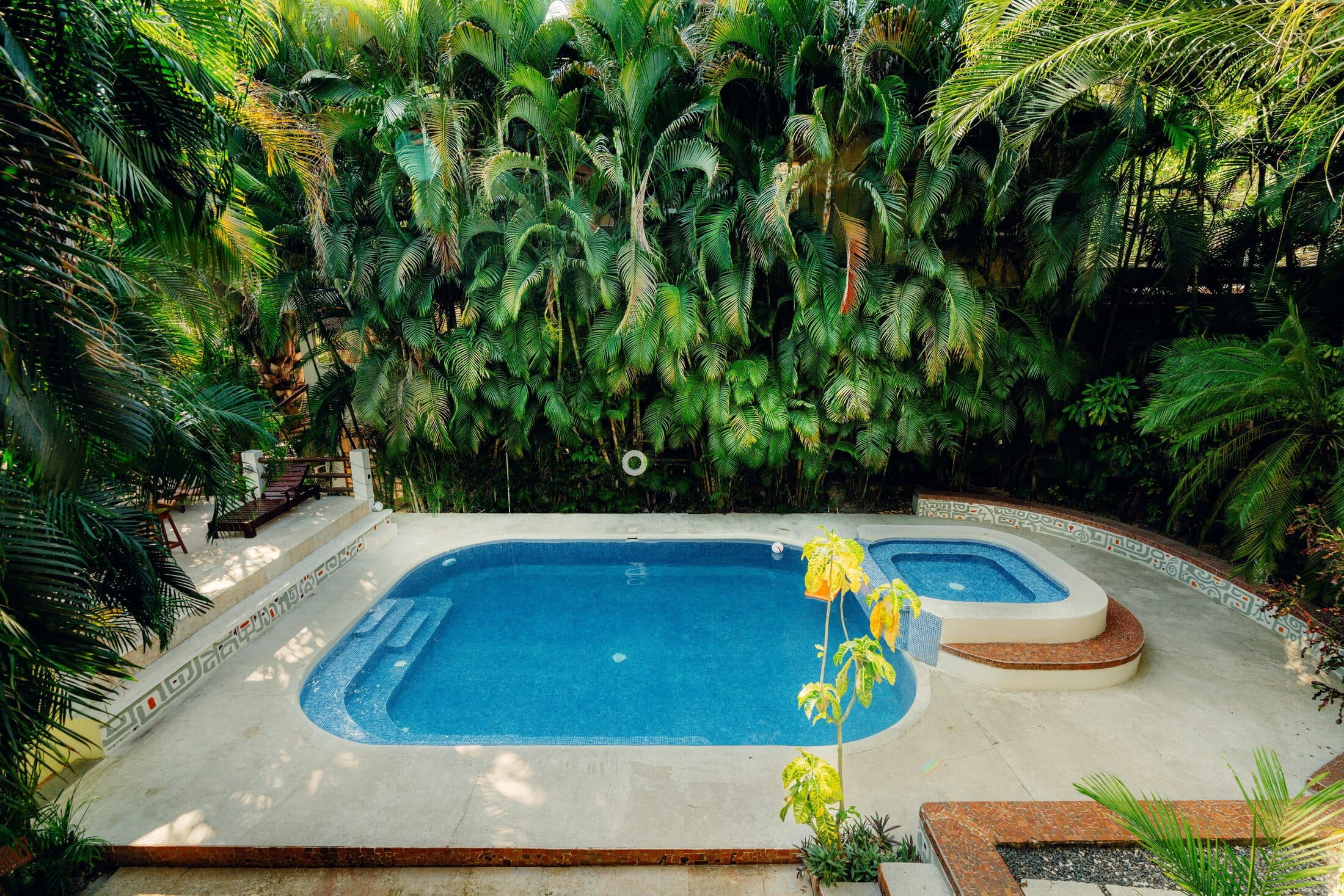 Dreamcatcher Villa pool wrapped in tropical garden