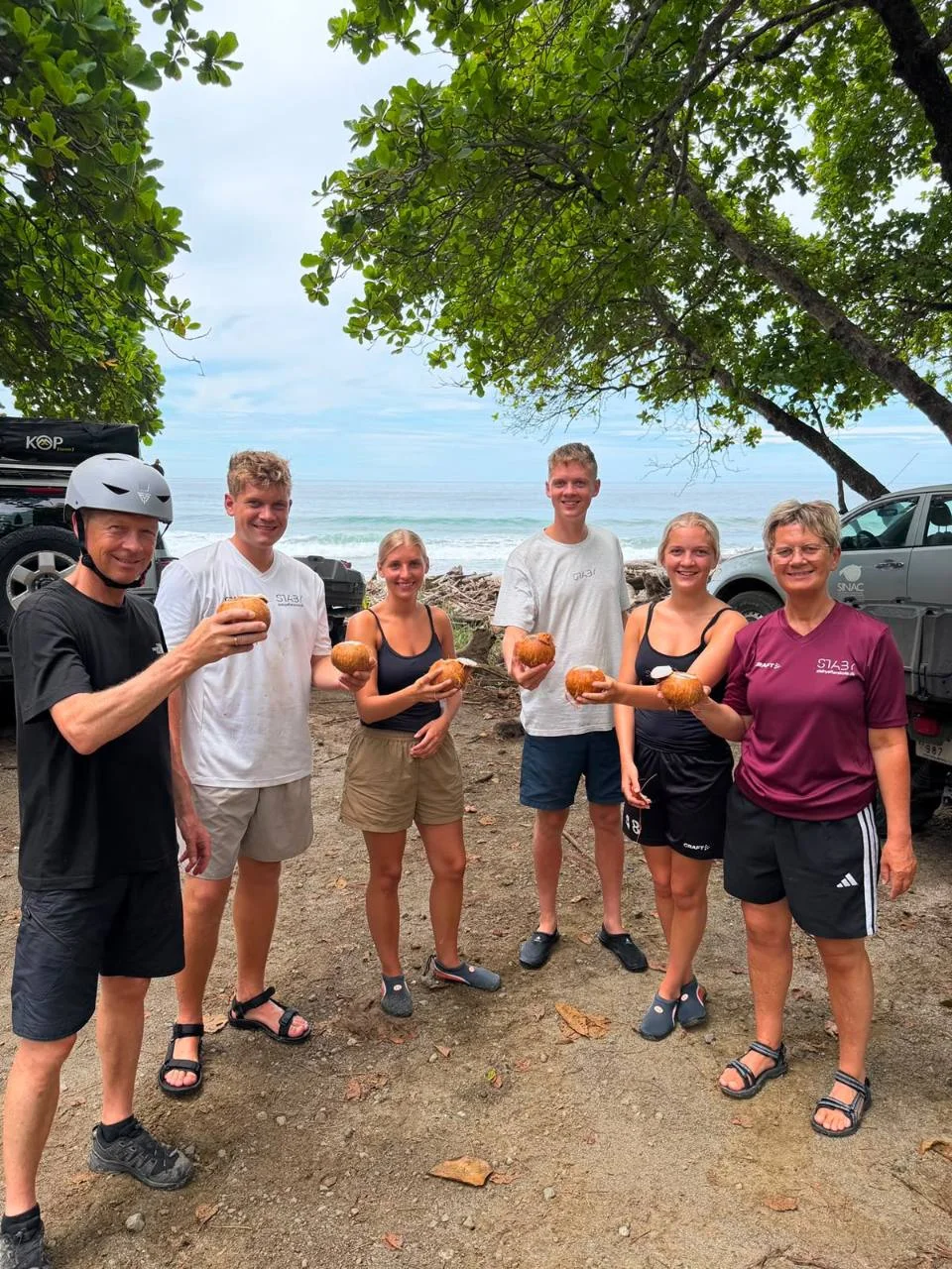 Guided ATV group enjoying a beach stop