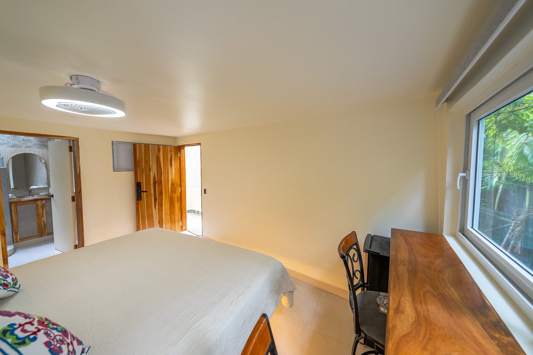 #27 Intimate King Room with Projector: sleeping area and beds
